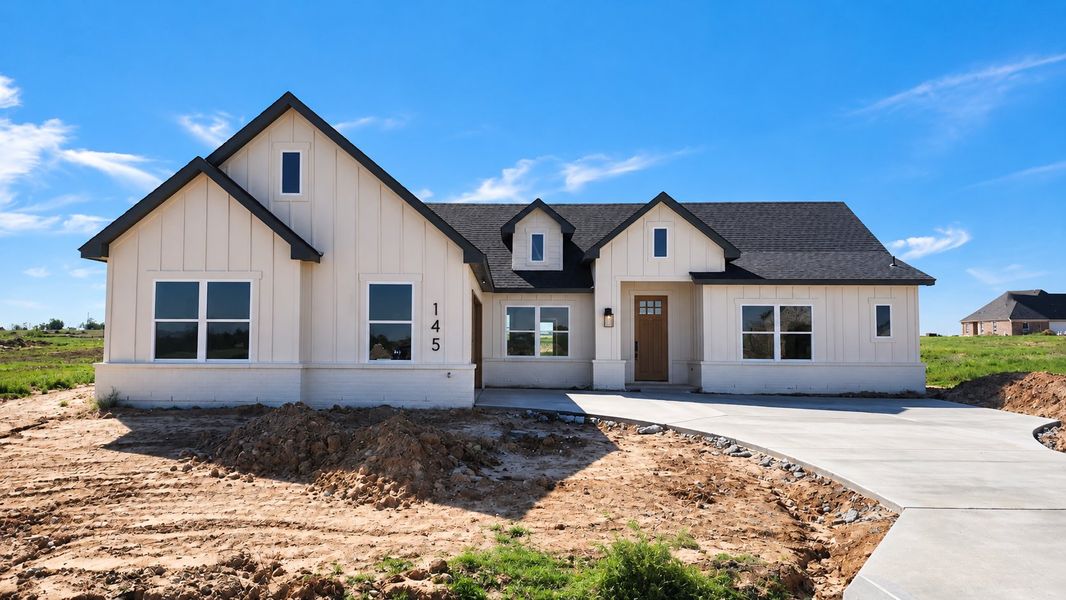 Front exterior of a new home in Stagecoach Crossing, Bridgeport, TX, highlighting curb appeal (Image 1). Front exterior of a new home in Stagecoach Crossing, Bridgeport, TX, highlighting curb appeal (Image 1).