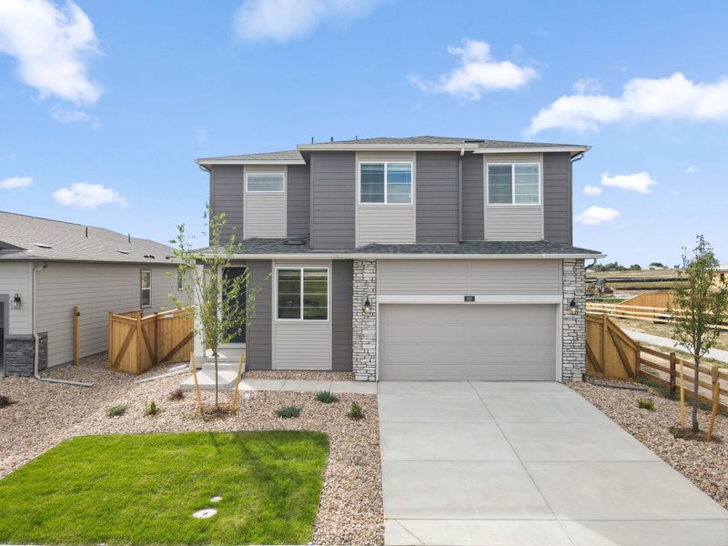 Front exterior of a new home in Murata Farms, Fort Lupton, CO, highlighting curb appeal (Image 2). Front exterior of a new home in Murata Farms, Fort Lupton, CO, highlighting curb appeal (Image 2).