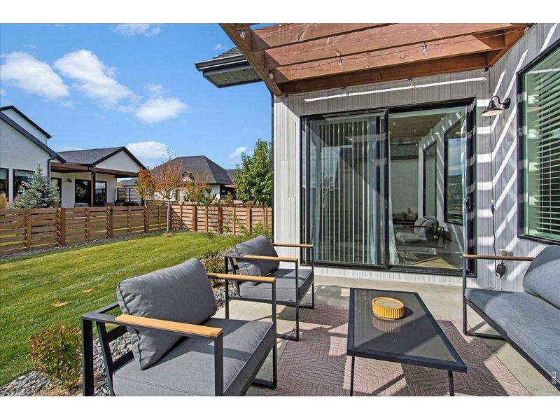 Exterior details and patio area of a home in Pelican Shores at Water Valley, Windsor (Image 24).
