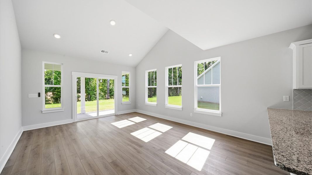 Elegant family room with hardwood flooring and open-concept flow in this first-class DRB Homes design