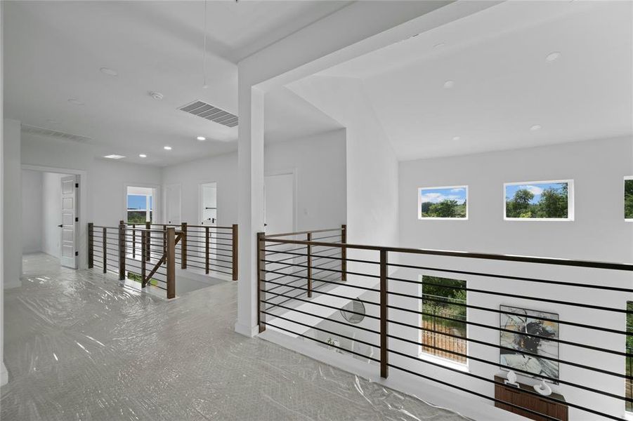 Hall featuring an upstairs landing and recessed lighting Hall featuring an upstairs landing and recessed lighting