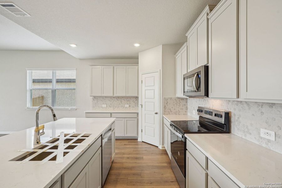 Furnished interior view inside a new home in Sagebrooke - Premier Series, San Antonio (Image 14). Furnished interior view inside a new home in Sagebrooke - Premier Series, San Antonio (Image 14).