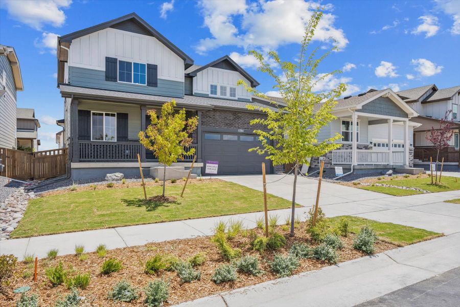 Front exterior of a new home in Painted Prairie, Aurora, CO, highlighting curb appeal (Image 1). Front exterior of a new home in Painted Prairie, Aurora, CO, highlighting curb appeal (Image 1).