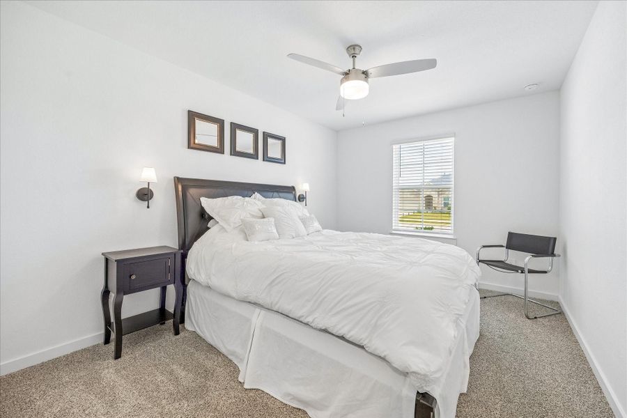 This is the second of the 3 bedrooms off the hallway at the front.  It is also approximately 13' x 10', with a ceiling fan.