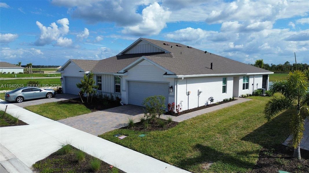 Front exterior of a new home in , Punta Gorda, FL, highlighting curb appeal (Image 11).