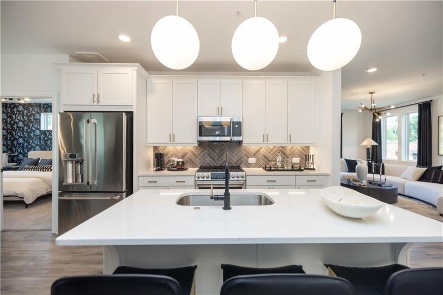 Enjoy eating at this beautiful kitchen island. Not actual home. Photos of Model Home.