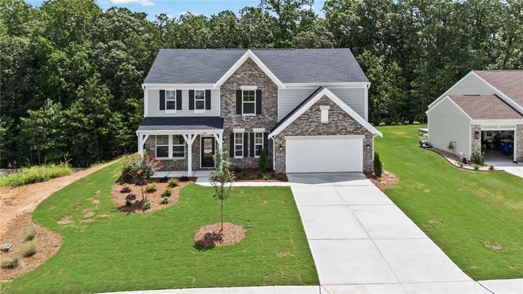 Front exterior of a new home in Pickens Bluff, Dallas, GA, highlighting curb appeal (Image 17).