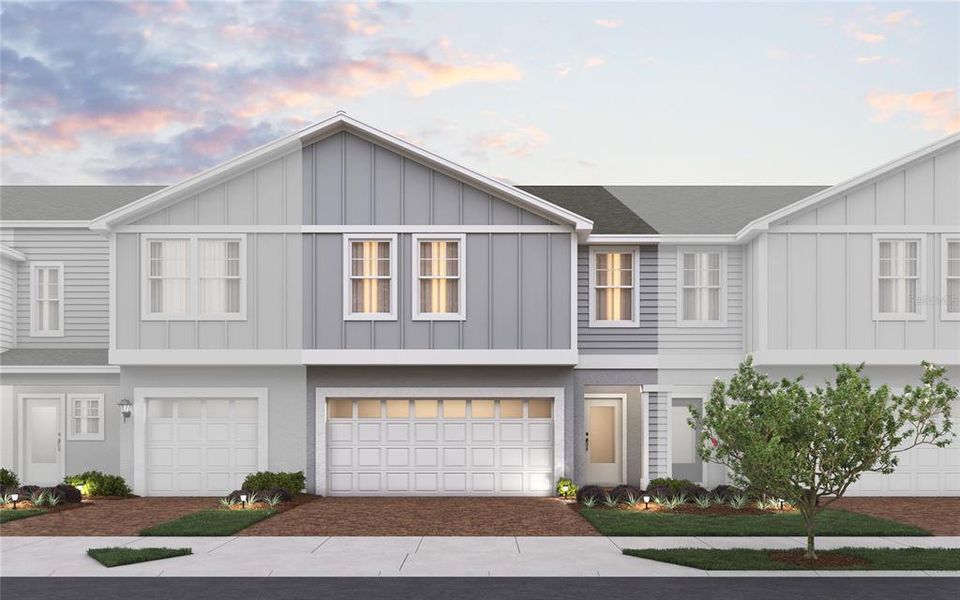 Front exterior of a new home in Blue Springs Reserve Townhomes, Groveland, FL, highlighting curb appeal (Image 1). Front exterior of a new home in Blue Springs Reserve Townhomes, Groveland, FL, highlighting curb appeal (Image 1).