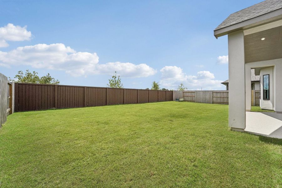 Exterior details and patio area of a home in Del Bello Lakes 60', Manvel (Image 27).