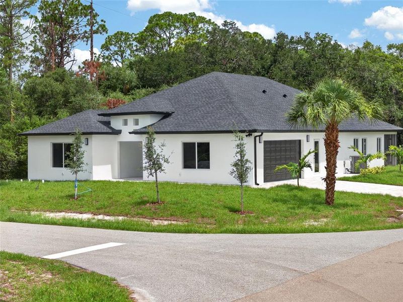 Front exterior of a new home in , Port Charlotte, FL, highlighting curb appeal (Image 2). Front exterior of a new home in , Port Charlotte, FL, highlighting curb appeal (Image 2).