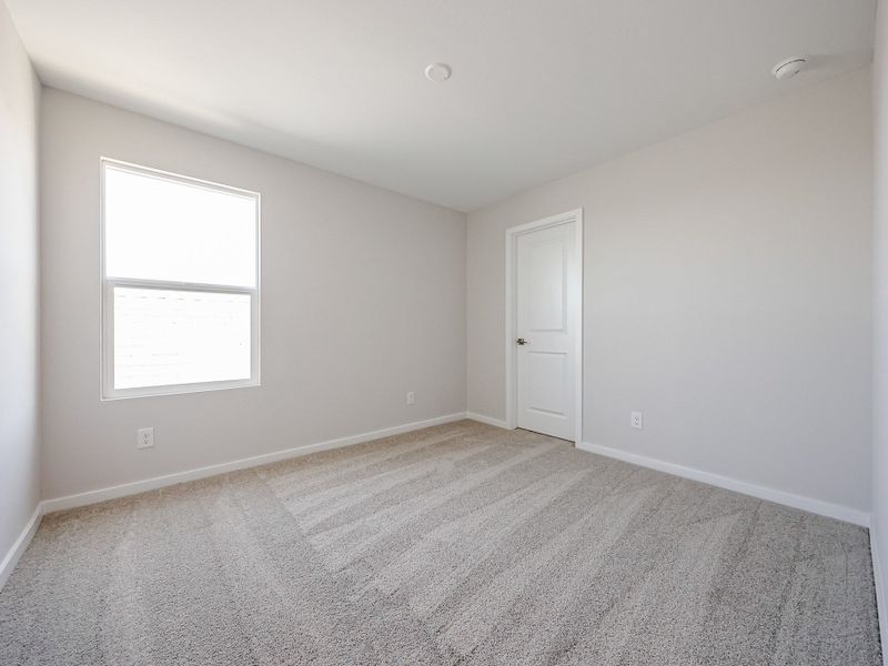 A room with a door and a window. A room with a door and a window.