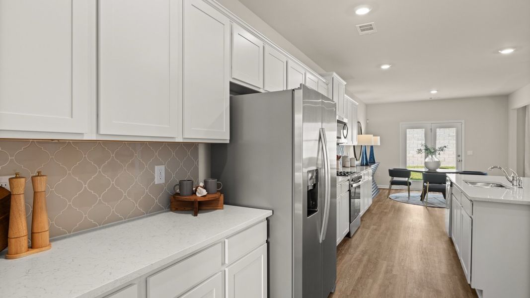 Representative furnished interior of a home built from the Halton by D.R. Horton in Brooks Station, Dacula (Image 7).