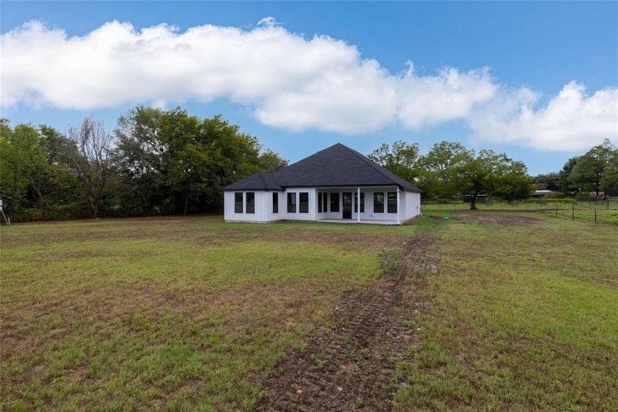 Ranch-style house with a front lawn