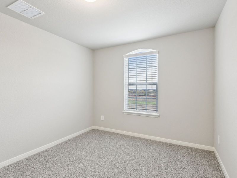 Guest bedroom in the San Jacinto floorplan at a Meritage Homes community.