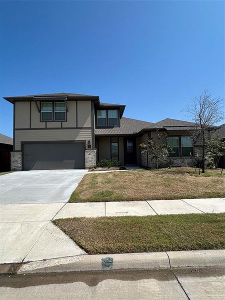 View of front of house featuring concrete driveway, a garage, a front yard, and a shingled roof View of front of house featuring concrete driveway, a garage, a front yard, and a shingled roof