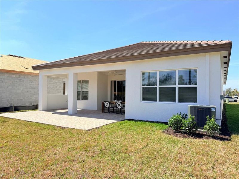 Exterior details and patio area of a home in Valencia Ridge, Wesley Chapel (Image 4).