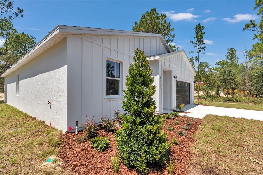 Front exterior of a new home in , Dunnellon, FL, highlighting curb appeal (Image 2).
