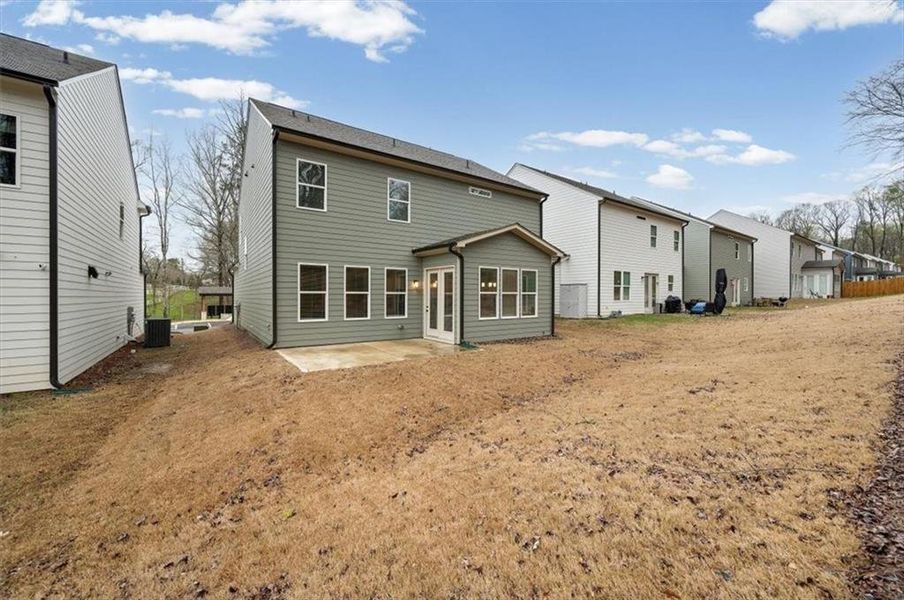 Exterior details and patio area of a home in Enclave at Edgewater, Holly Springs (Image 30).