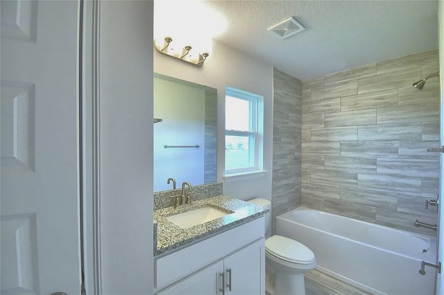 Furnished interior view inside a new home in Lake Juliana Estates, Auburndale (Image 13).