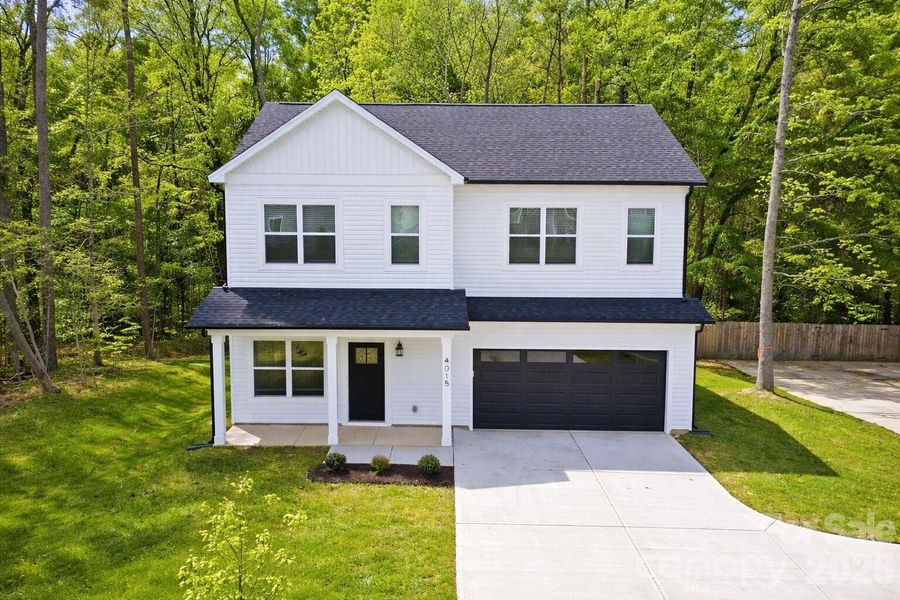 Front exterior of a new home in , Charlotte, NC, highlighting curb appeal (Image 24).