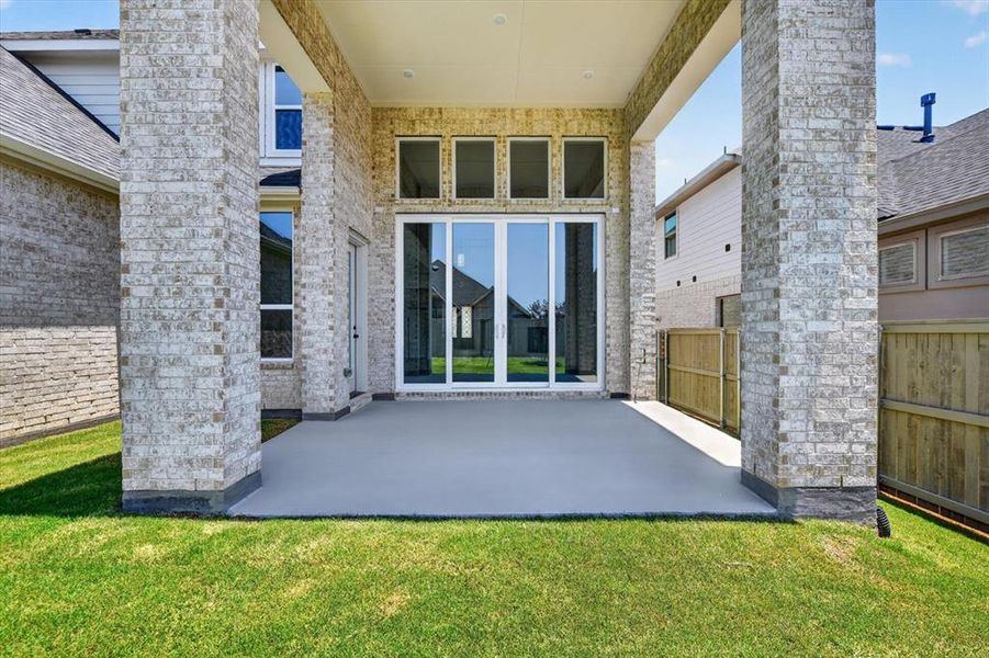 Exterior details and patio area of a home in Pecan Square, Northlake (Image 3).