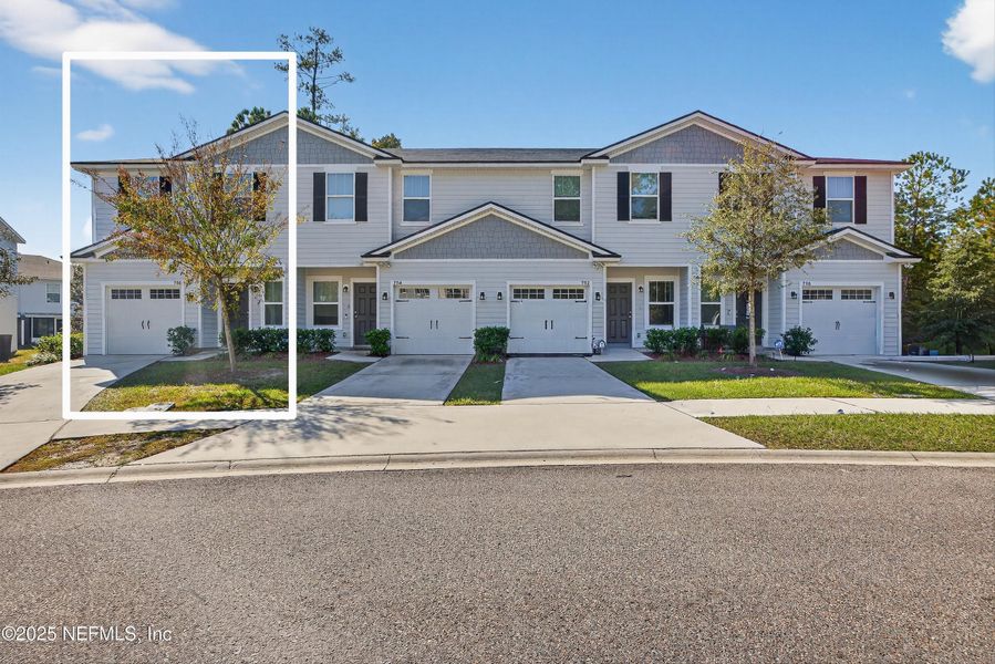 Front exterior of a new home in , Jacksonville, FL, highlighting curb appeal (Image 1).