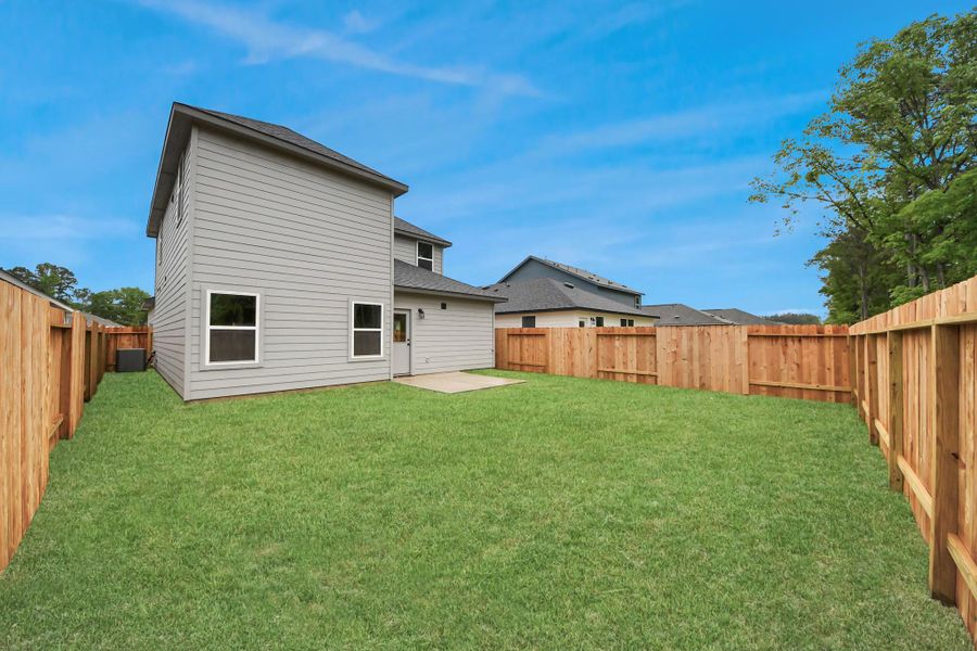 Exterior details and patio area of a home in The Enclave at Spring Branch, Montgomery (Image 4).