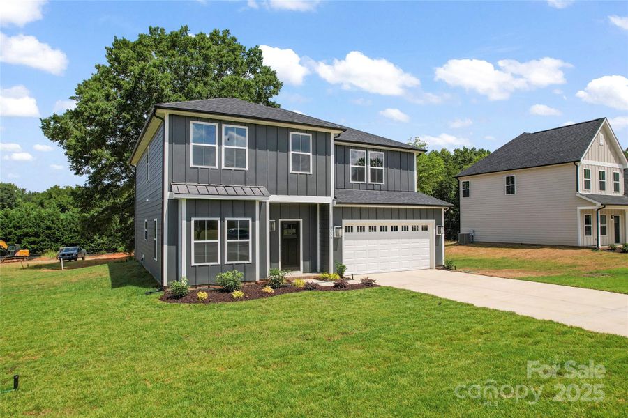 Front exterior of a new home in , Harrisburg, NC, highlighting curb appeal (Image 19).