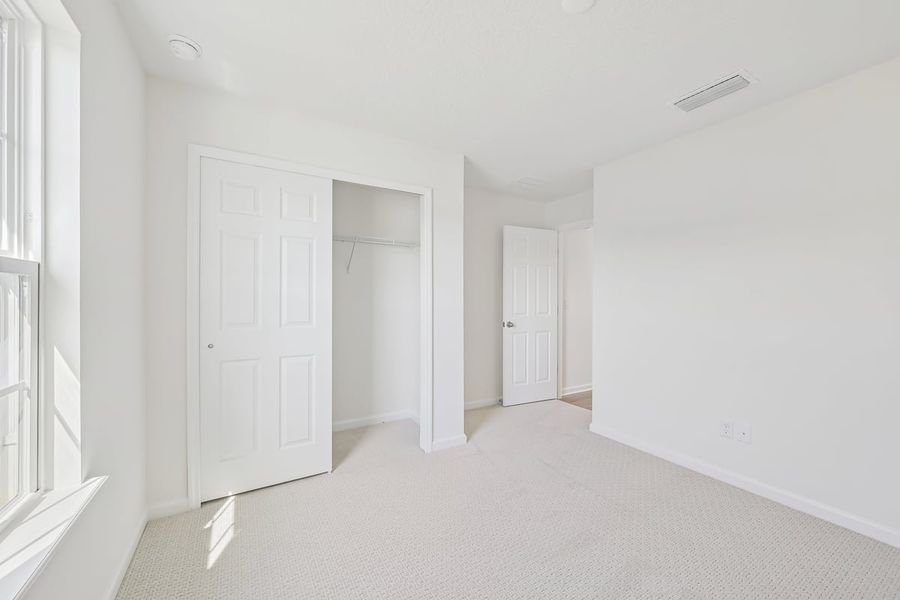 Spacious, unfurnished interior of a new home in Somerset - Executive Series, Palm Coast (Image 13). Spacious, unfurnished interior of a new home in Somerset - Executive Series, Palm Coast (Image 13).
