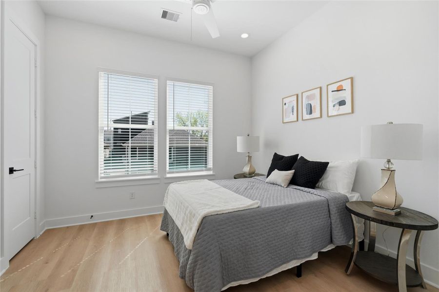 secondary bedroom with  large windows, and great natural light.