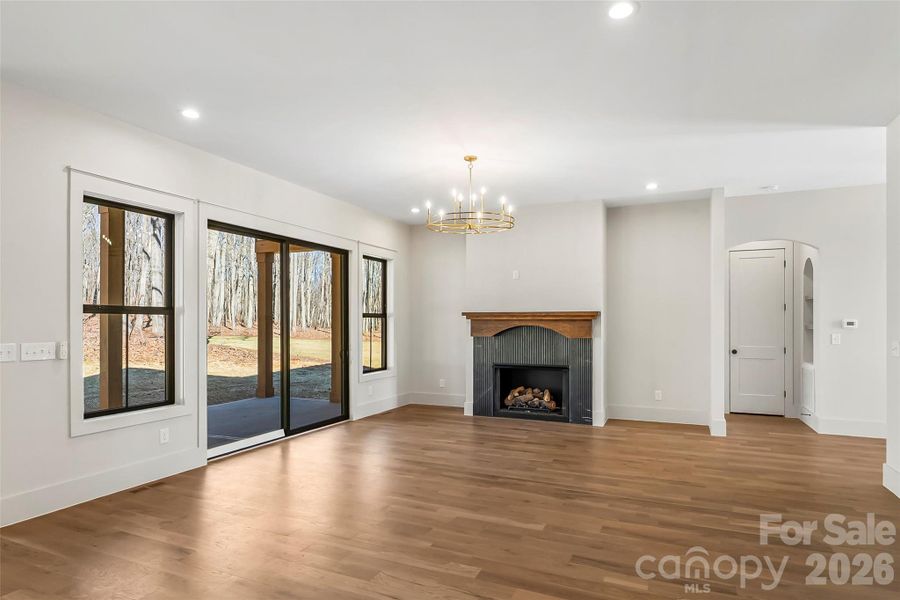 This is where everday feels elevated-a light filled room designed for gathering, with sliders that flow to the outdoors.