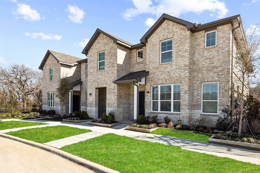 Front exterior of a new home in Mockingbird Estates Townhomes, Fort Worth, TX, highlighting curb appeal (Image 2).