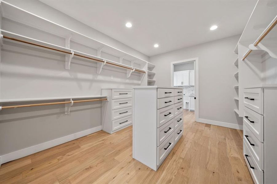 Huge main closet with 3 built ins. Leads to the utility room.