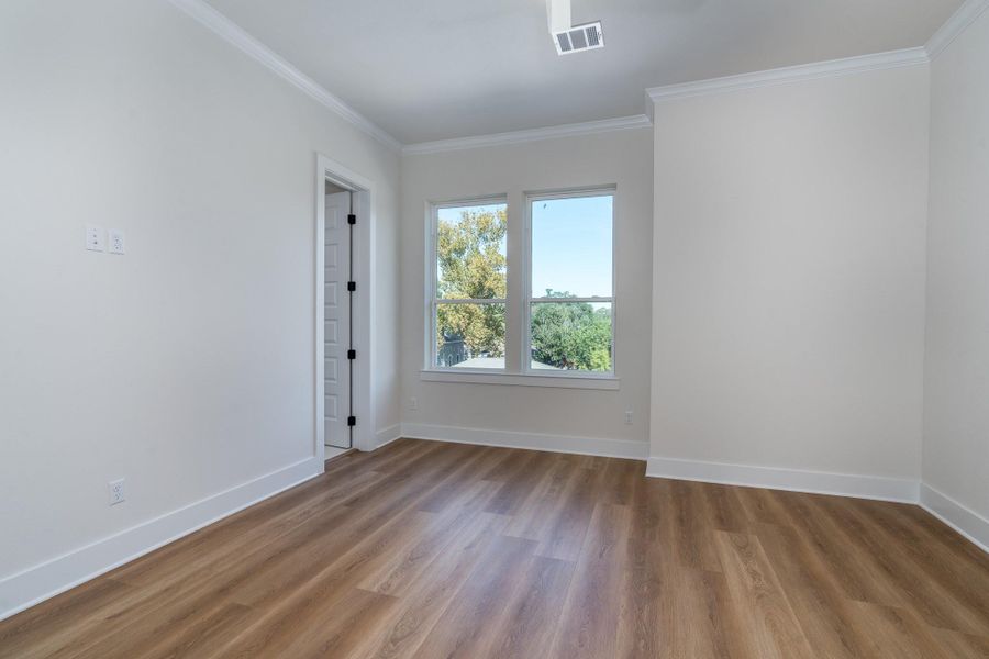 This bedroom also includes warm vinyl flooring and large windows. This bedroom also includes warm vinyl flooring and large windows.