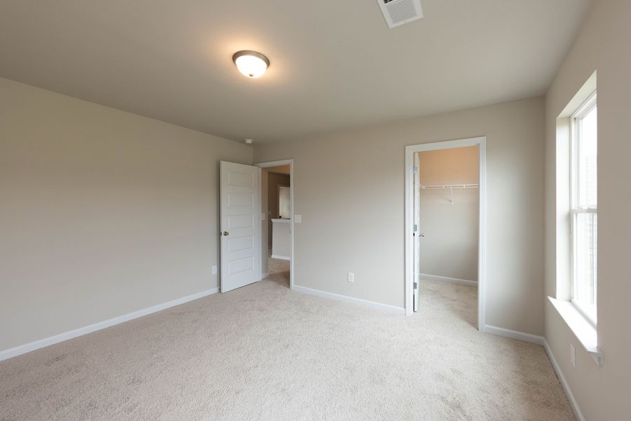 Secondary bedroom #3 with expansive walk in closet