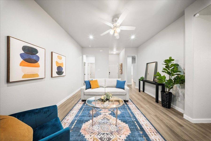 Living area with wood finished floors, recessed lighting, and ceiling fan Living area with wood finished floors, recessed lighting, and ceiling fan