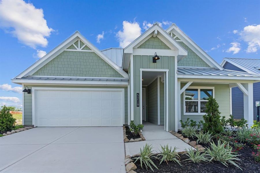 Front exterior of a new home in Grand Cay Harbour, Texas City, TX, highlighting curb appeal (Image 21). Front exterior of a new home in Grand Cay Harbour, Texas City, TX, highlighting curb appeal (Image 21).