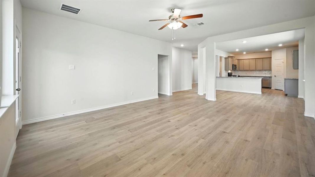 Unfurnished living room with recessed lighting, light wood-style floors, and ceiling fan