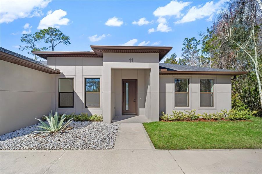 Front exterior of a new home in , Palm Coast, FL, highlighting curb appeal (Image 32).