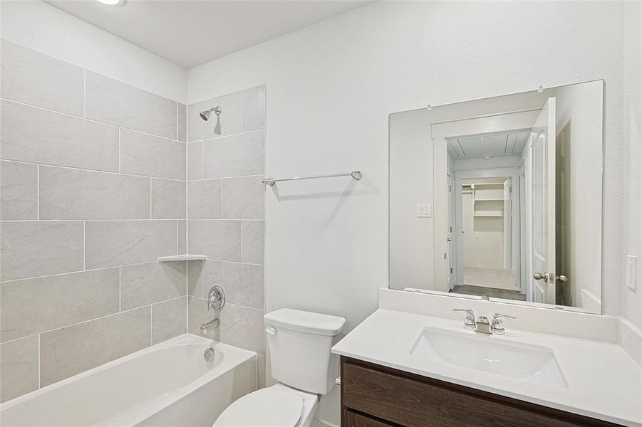Full bathroom with shower / bathtub combination and vanity