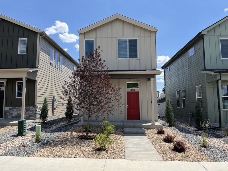 Front exterior of a new home in Liberty Draw, Evans, CO, highlighting curb appeal (Image 1). Front exterior of a new home in Liberty Draw, Evans, CO, highlighting curb appeal (Image 1).