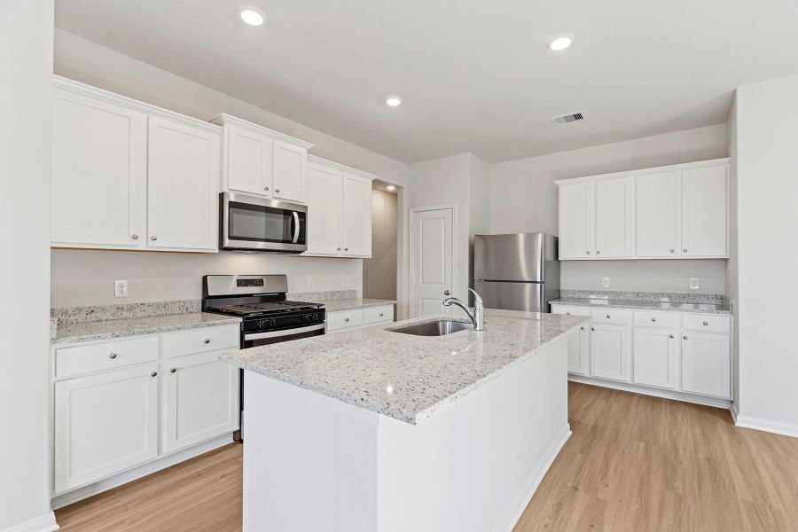 Furnished interior view inside a new home in Canterra Creek, Iowa Colony (Image 3).
