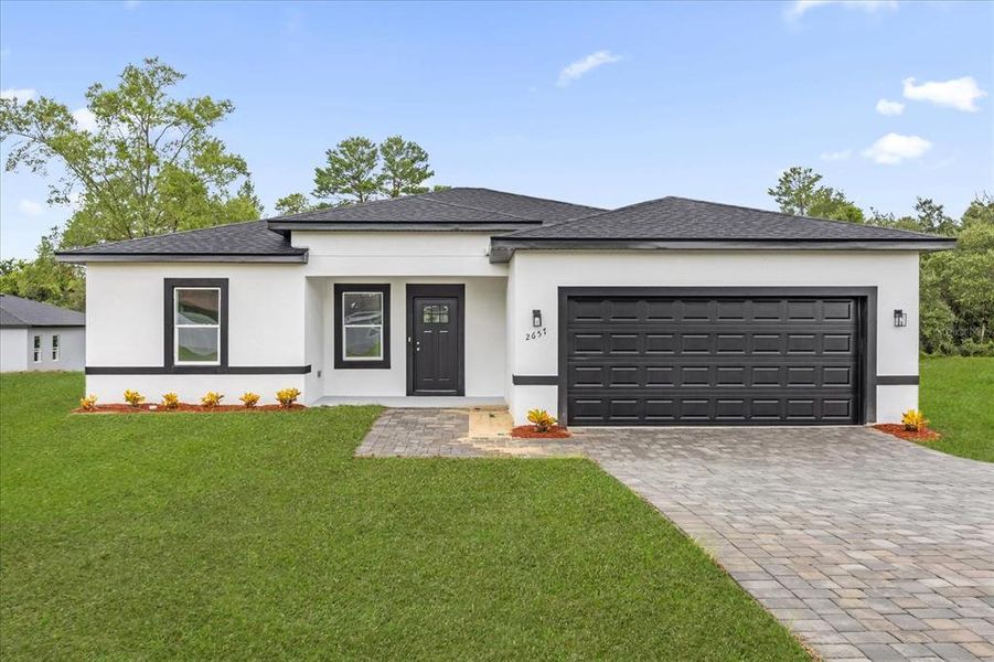 Front exterior of a new home in , Ocala, FL, highlighting curb appeal (Image 23).