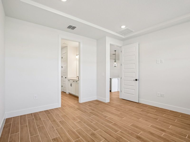 Spacious, unfurnished interior of a new home in Magnolia Bay - Reserve Series, Nokomis (Image 11).