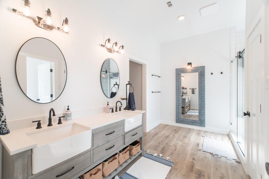 The primary suite is a tranquil escape, with this view leading into the beautifully designed bathroom. It also offers a spacious walk-in closet! The primary suite is a tranquil escape, with this view leading into the beautifully designed bathroom. It also offers a spacious walk-in closet!