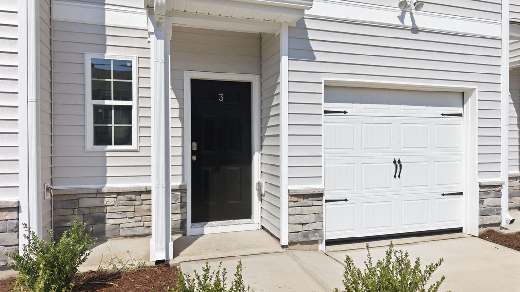 Exterior details and patio area of a home in The Townes at Ridgewood Farms, Winterville (Image 3).