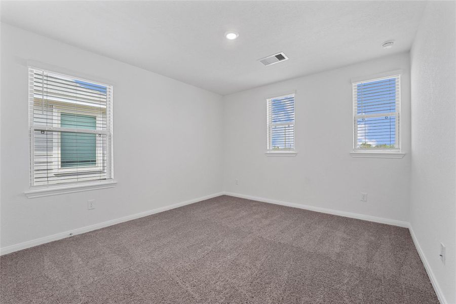 Enjoy an additional private space in this comfortable secondary bedroom. The room is filled with natural light, offers plenty of storage in the closet, and is perfectly positioned for quiet and relaxation. Enjoy an additional private space in this comfortable secondary bedroom. The room is filled with natural light, offers plenty of storage in the closet, and is perfectly positioned for quiet and relaxation.