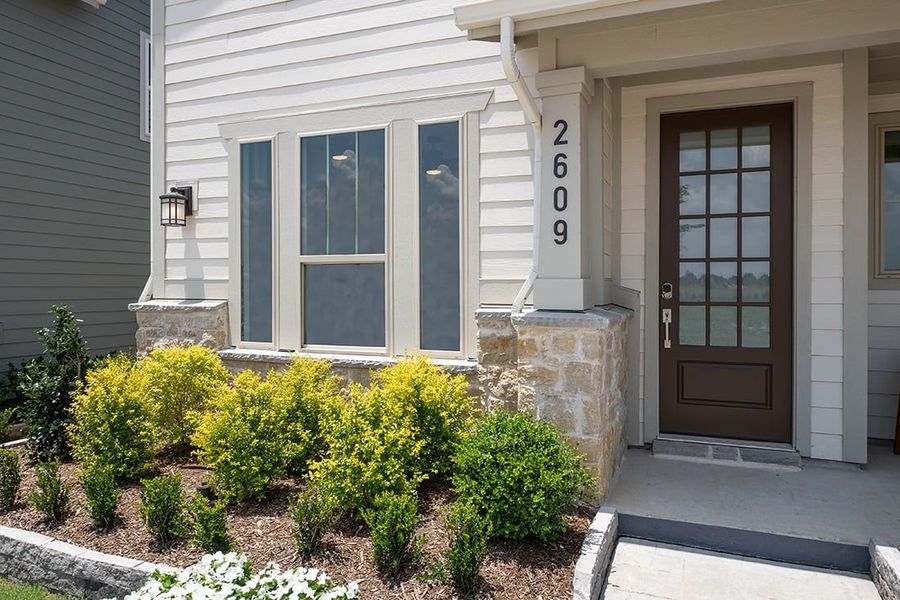 Exterior details and patio area of a home in Carriage Collection at Painted Tree, McKinney (Image 2). Exterior details and patio area of a home in Carriage Collection at Painted Tree, McKinney (Image 2).