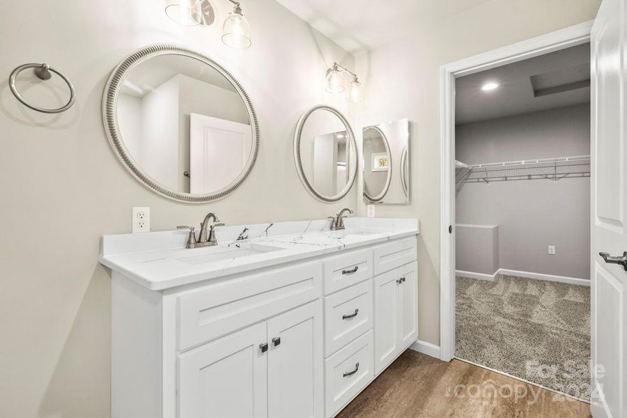 Double bowl vanity with custom cabinets and quartz countertops