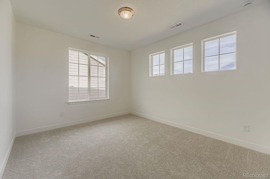 Spacious, unfurnished interior of a new home in Newlin Crossing: The Monarch Collection, Parker (Image 10).